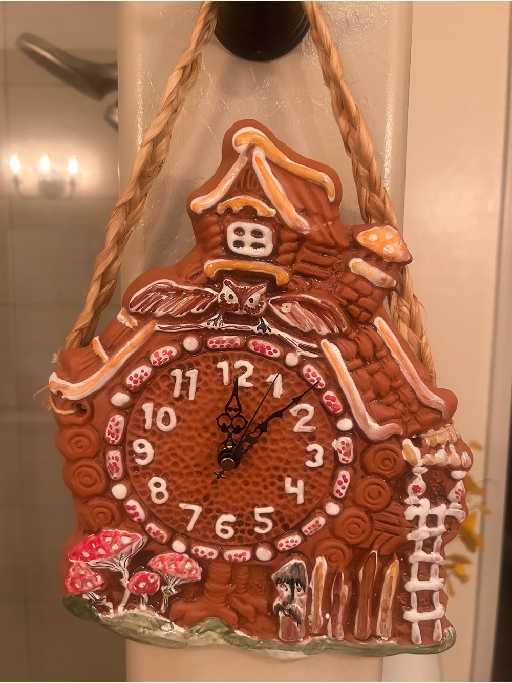 Hand Crafted gingerbread-style wall clock in brown with white and red accents